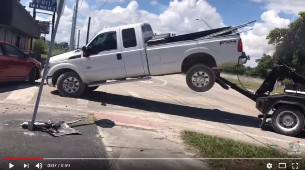 Watch This Repossessed Pickup Have A Tug-Of-War With A Tow Truck