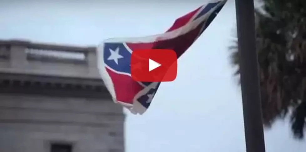 Woman Climbed Pole to Do THIS to the Confederate Flag + Then Was Arrested [VIDEO]