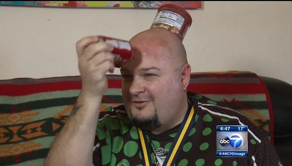 This Guy Sticks Things To His Bald Head For a Living [VIDEO]