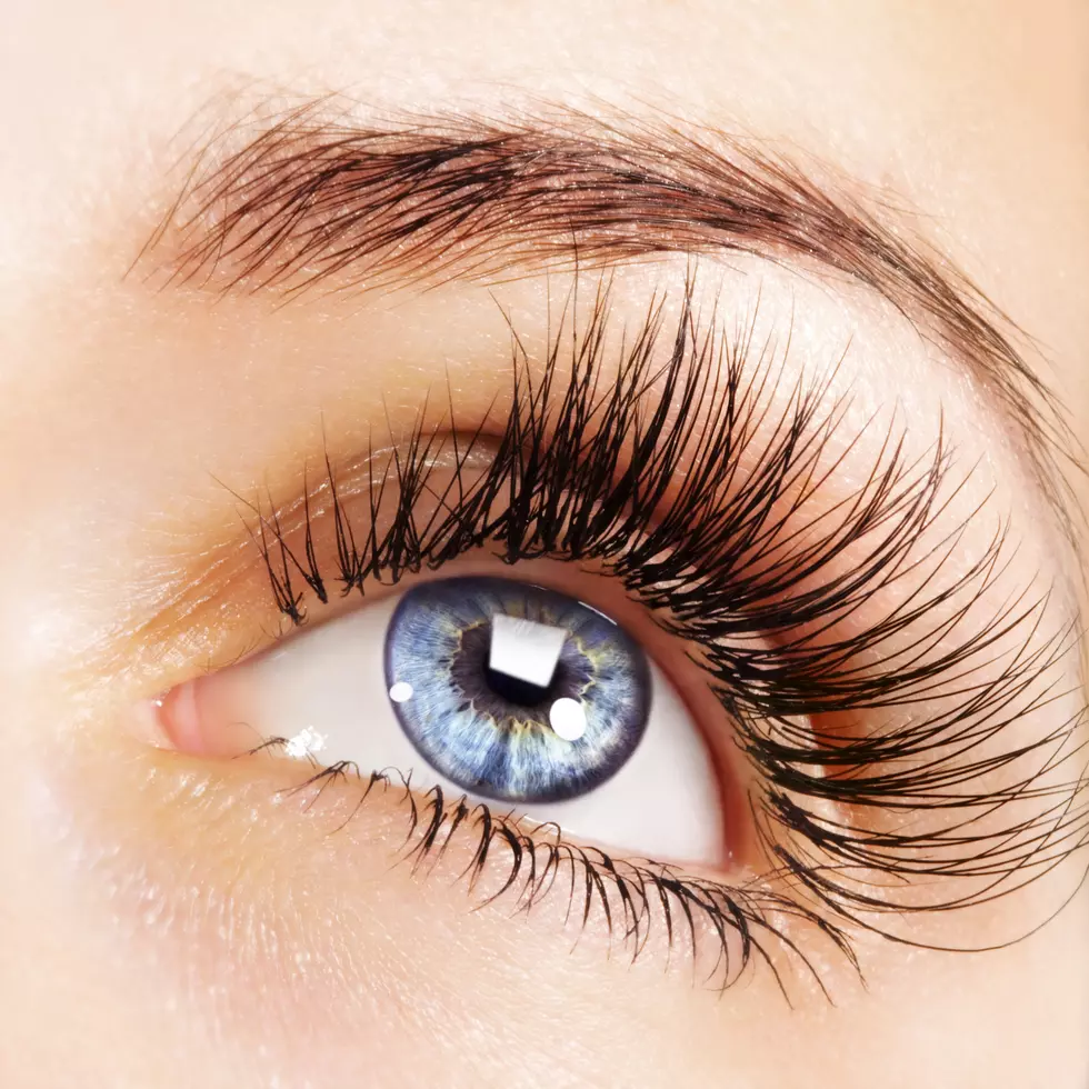 Woman blue eye with extremely long eyelashes