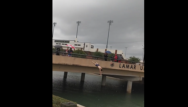 Lamar University Students Dive From Overpass Into Floodwater