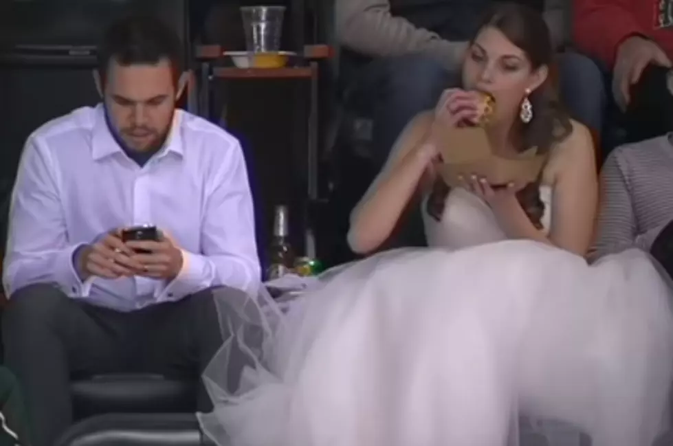 This Bride Eating a Burger at a Hockey Game Just Won the Internet [VIDEO]