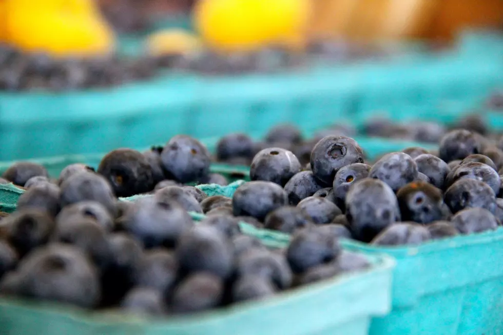 Fresh blueberries in baskets at a local farmer's market
