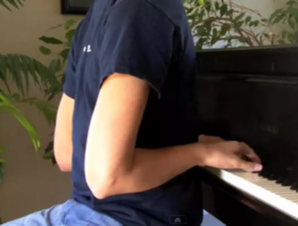 Man Plays Piano Facing Backwards