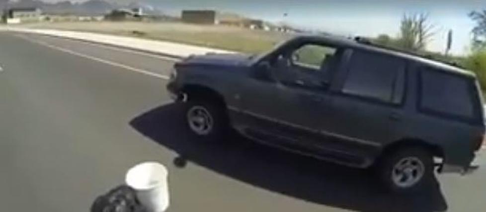 Man Rescues Coffee Cup Off the Back of Womans Bumper While They are Driving [VIDEO]
