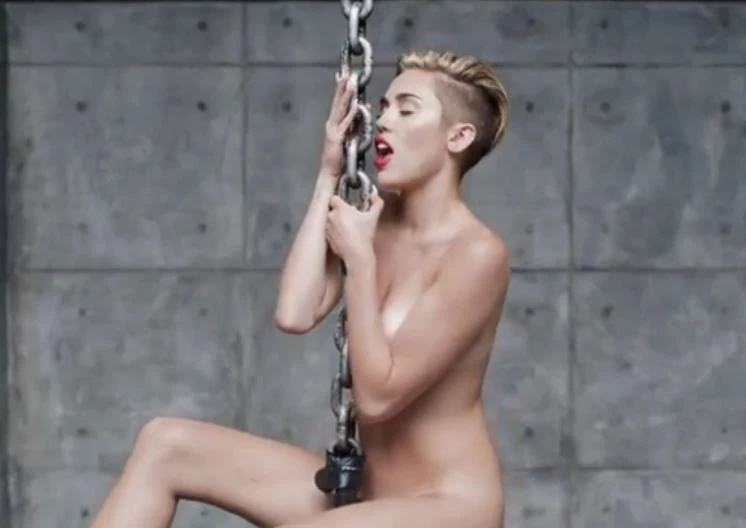 Miley Cyrus Gets Nude and Licks a Sledgehammer in New 'Wrecking Ball' Video