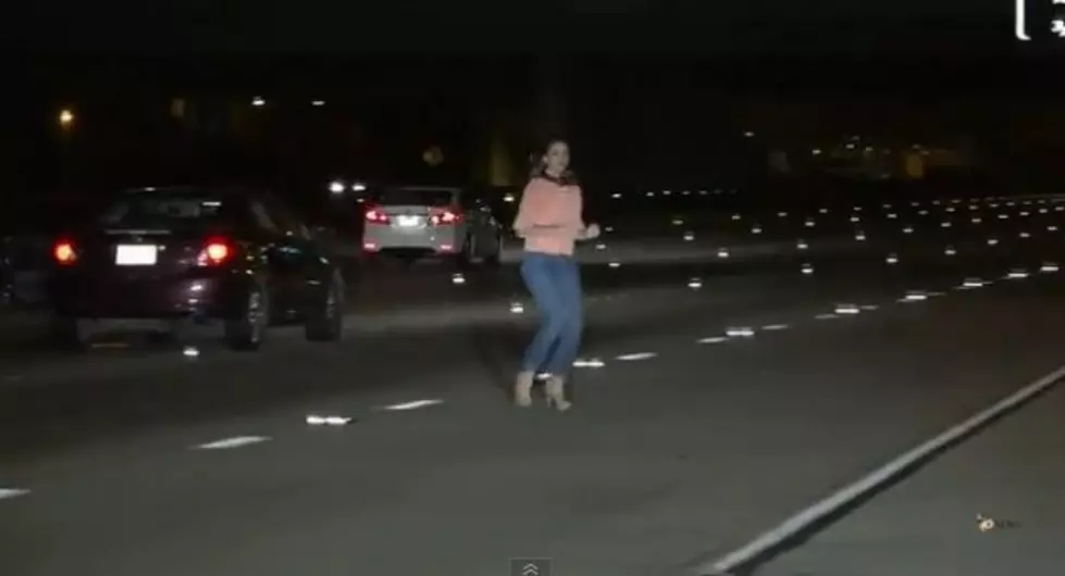 Woman is so Drunk That She Urinates on The Highway Next to Her Stalled Car, and Wanders Through Traffic [VIDEO]