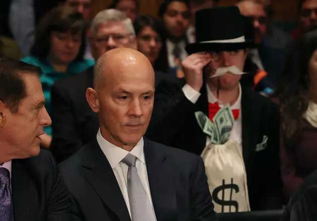 Person Dresses as Monopoly Man at Equifax Senate Hearing