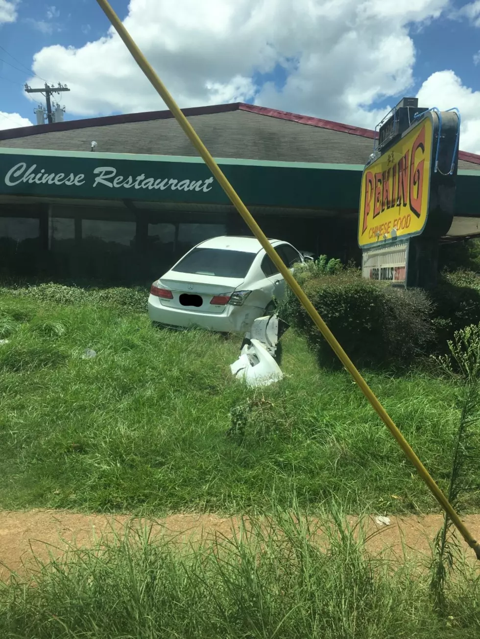 [PHOTOS] Car Goes Through Front Of Old Peking Location