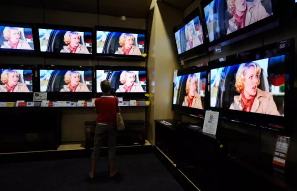 Woman Buys Plywood TVs In Arlington