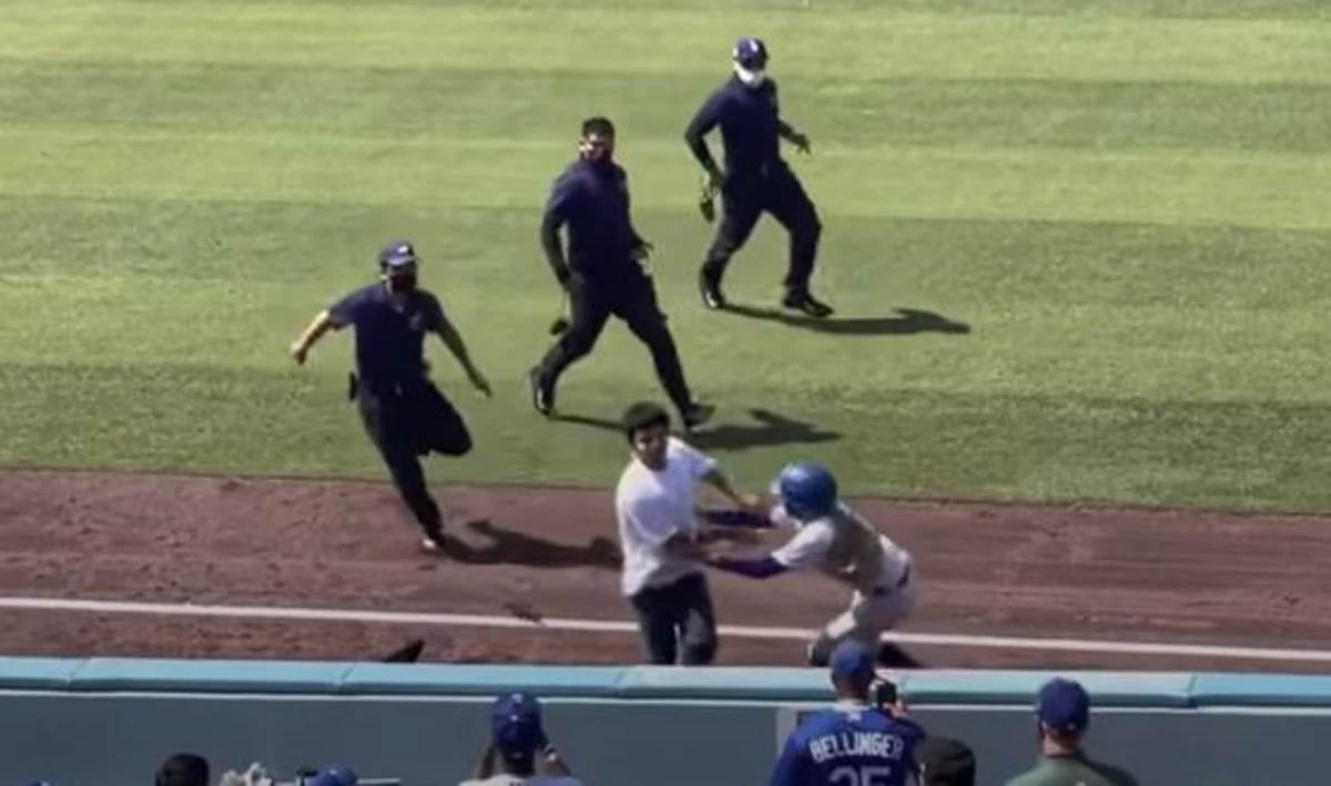 Dodgers ballgirl tackles fan on field