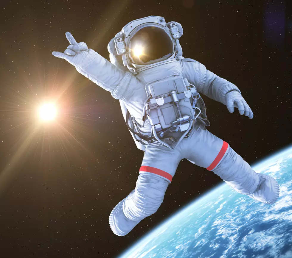 Rocking Astronaut on a black background, 3d render