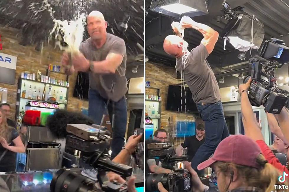 Texas Rattlesnake Stone Cold Steve Austin Downs Beer at Local Bar