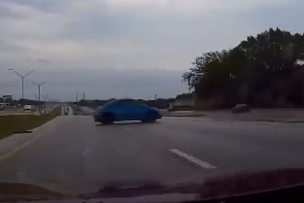 Speeding Car Loses Control on Rain-Soaked Highway in Dallas, Texas