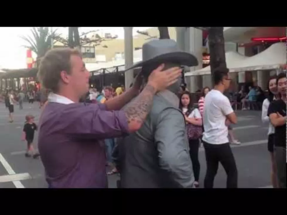 Watch a Douchebag Get Punched By a Street Performer