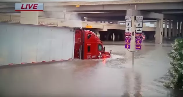Big Rig Attempts to Drive Through Flooded Texas Street [VIDEO]