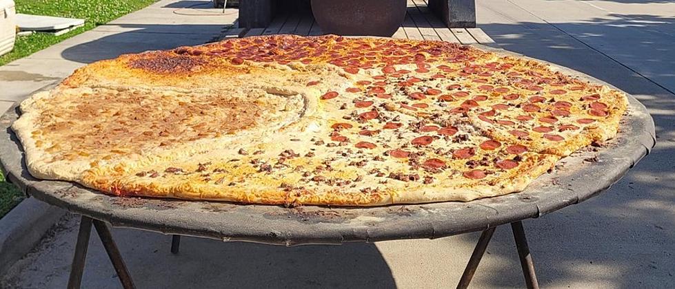 Texas Pizza Company Makes The Most Insanely Sized Pizzas I Have Ever Seen