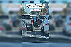 Man Checking BBQ Pit at Dallas Stoplight is Pure Texas