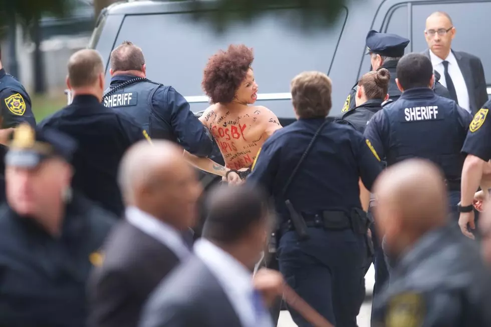 Topless Protester Charges at Bill Cosby as Retrial Begins