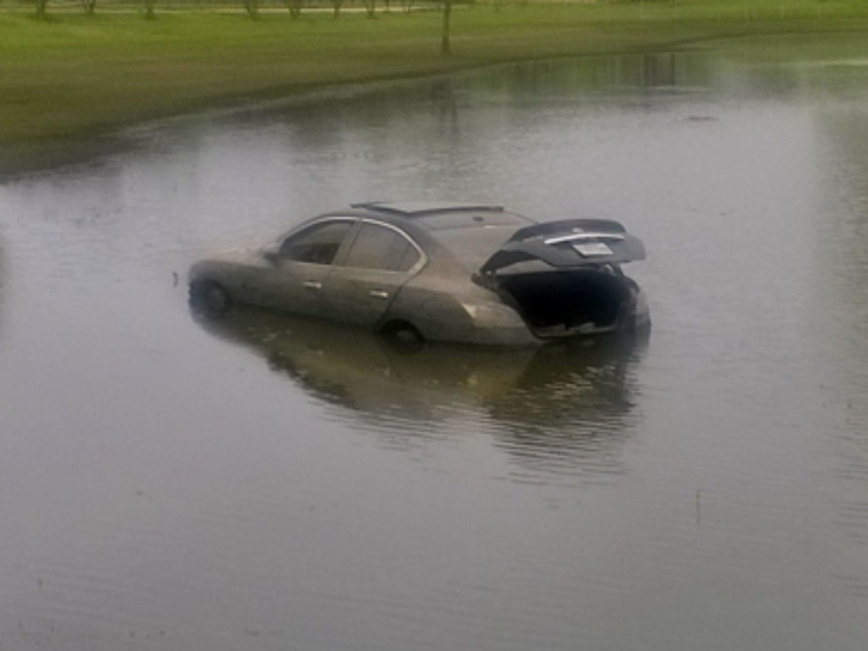 As Flood Waters Recede, Submerged Cars Become Visible At Jimmie Davis Cloverleaf