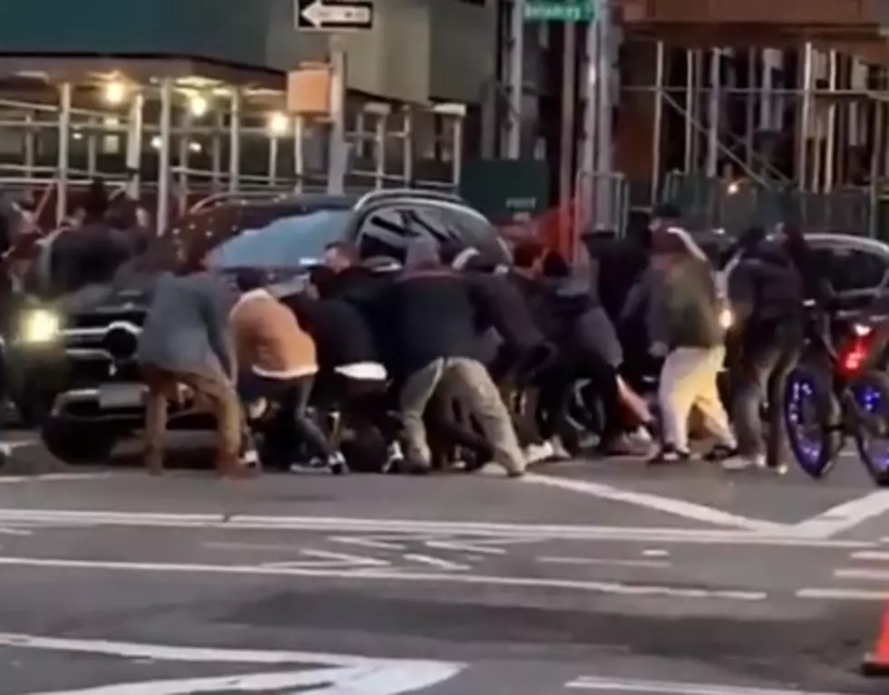 Watch as New Yorkers Team Up to Lift SUV off of a Woman