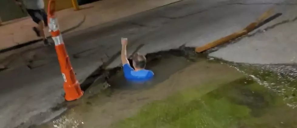 Watch This Guy Swim in a Louisiana Pothole [NSFW]