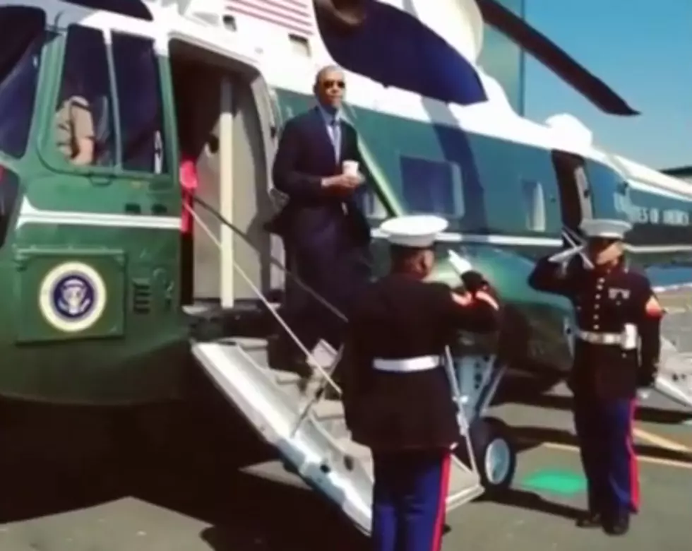 Obama Salutes Marine With Coffee Cup In Hand [Video]