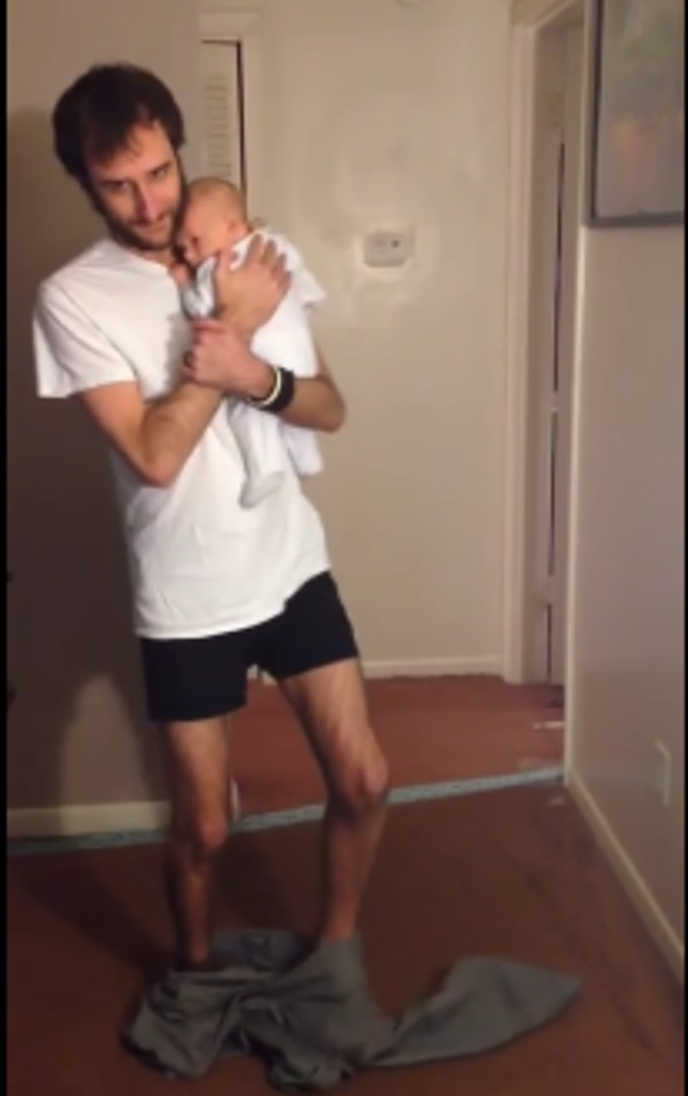 Guy Puts On Pants With No Hands…While Holding A Baby [Video]