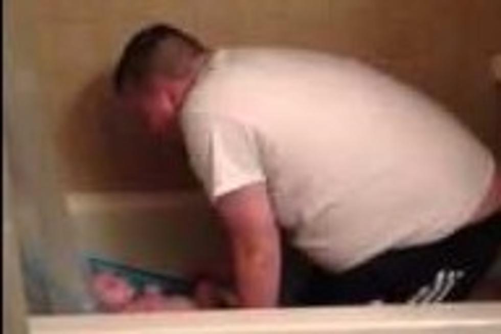 A Father Sings to Baby Son During Bathtime