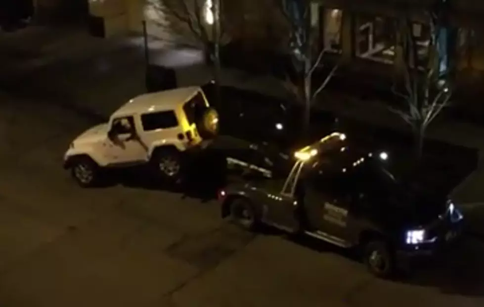 Guy in Chicago Drives his Car Straight Off a Tow Truck