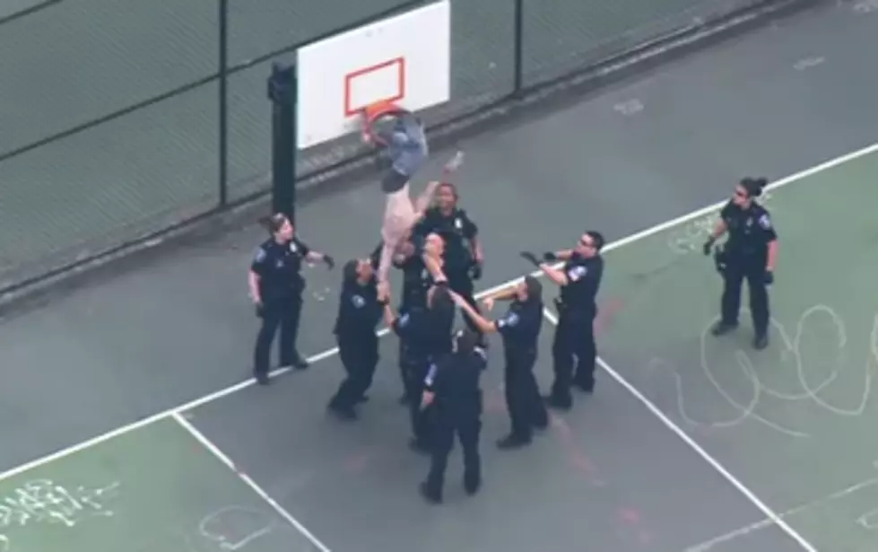 A Guy Got Stuck in a Basketball Hoop, Cops Came to the Rescue [VIDEO]