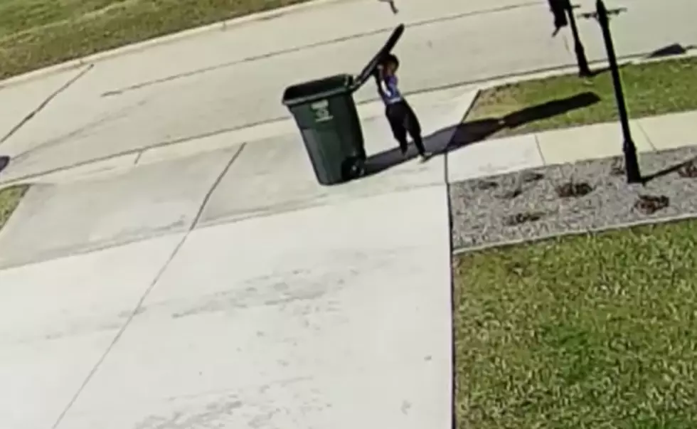 Poor Kid Struggles Against The Wind While Taking Out The Trash