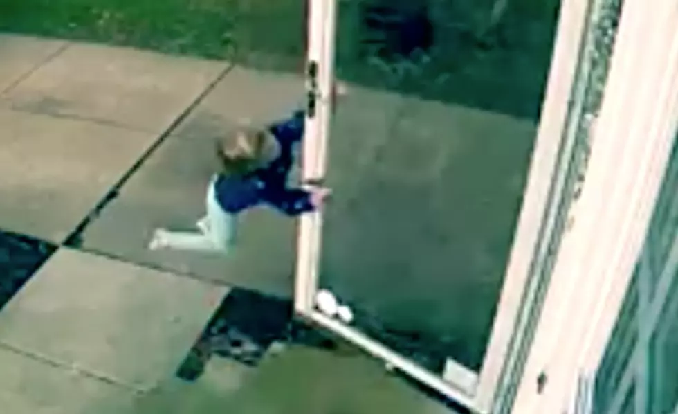 4-Year-Old Tries To Open The Door In The Wind, Flies While Holding Door Handle [VIDEO]