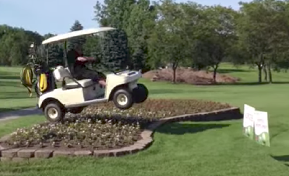 Driver In Golf Cart Attempts To Jump Flower Bed, Fails Miserably [VIDEO]