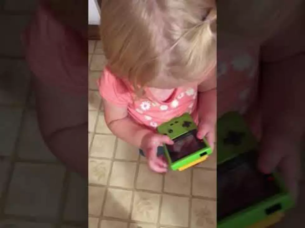 Adorable Girl Hilariously Tries to use Game Boy like an iPad [VIDEO]