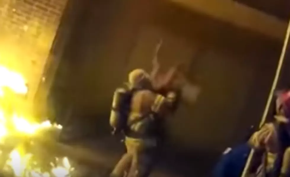 Firefighter Catches Child Thrown From a Burning Building [VIDEO]