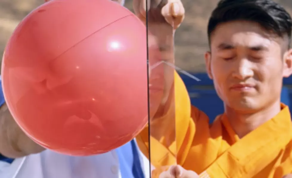 Monk Throws a Needle and Pops Balloon Behind Pane of Glass [VIDEO]