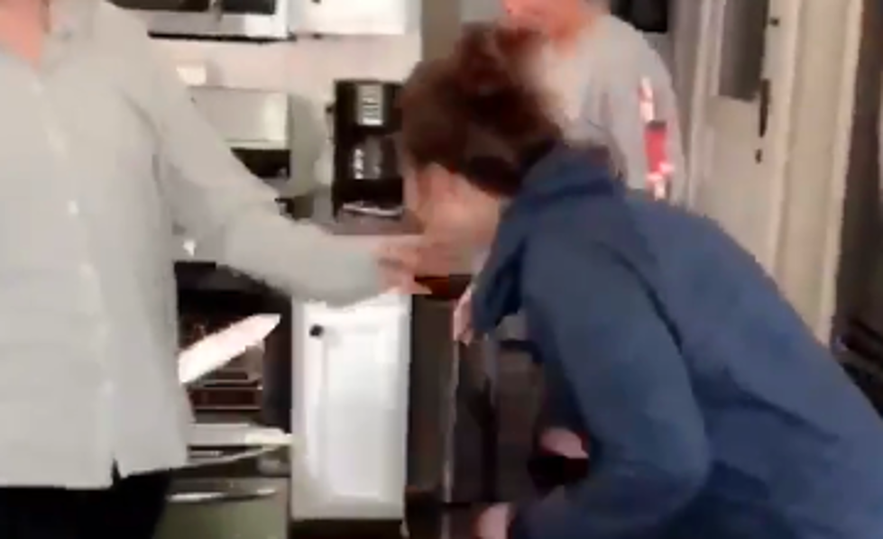 Drunk Woman Perfectly Throws Frozen Pizza into Oven Rack [VIDEO]