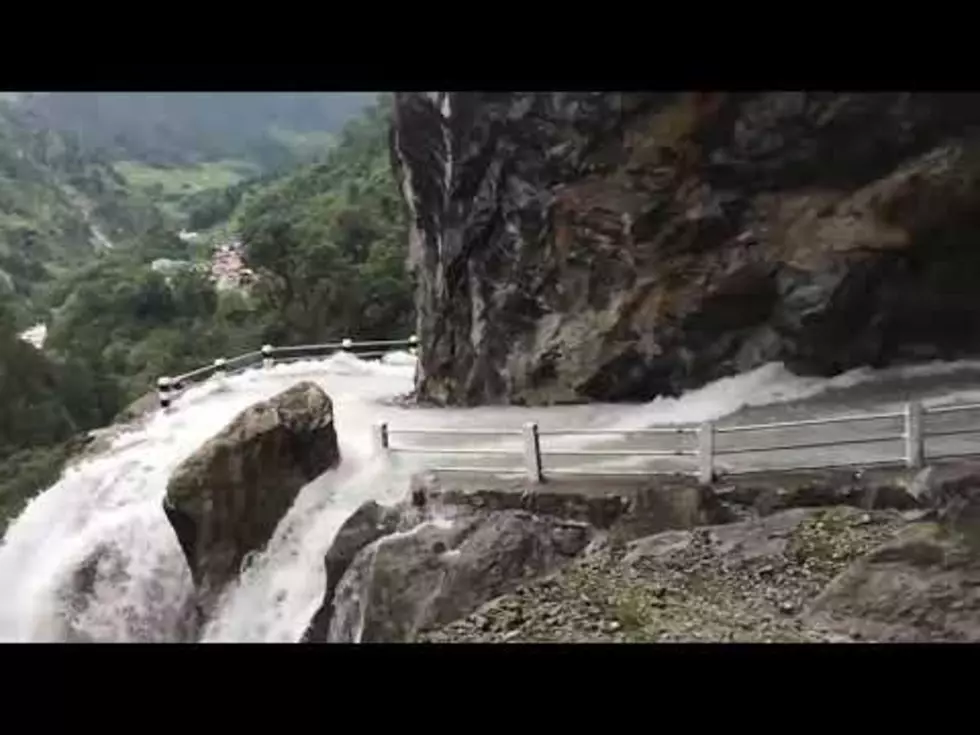 Bus Riding on a Cliff Gets Drenched by Waterfall [VIDEO]