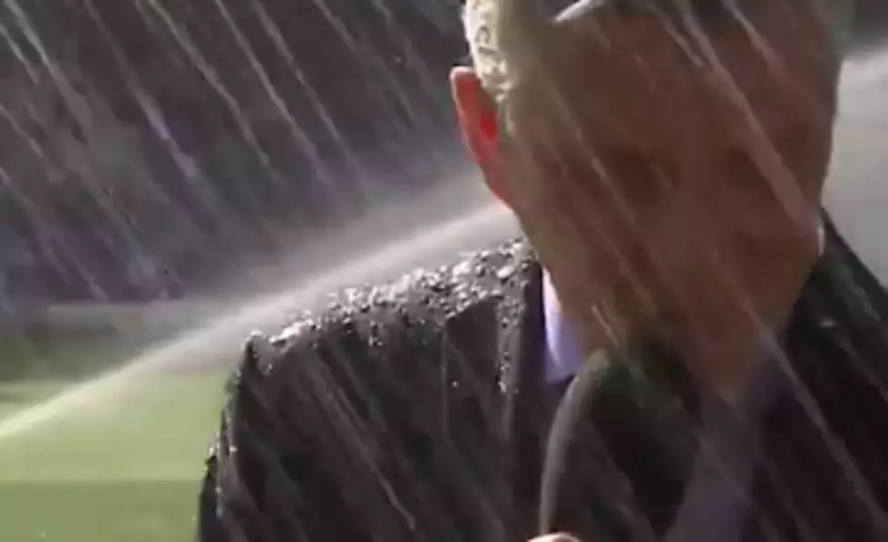 Sports Announcer Gets Sprayed by Sprinklers, Doesn&#8217;t Flinch [VIDEO]