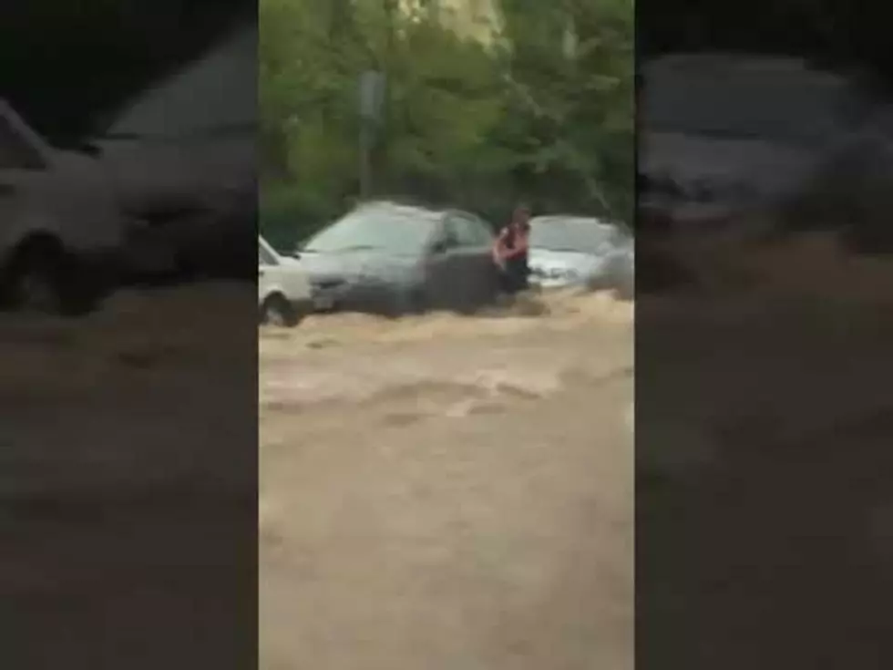 Woman Swept Down the Street During Flash Flood [VIDEO]