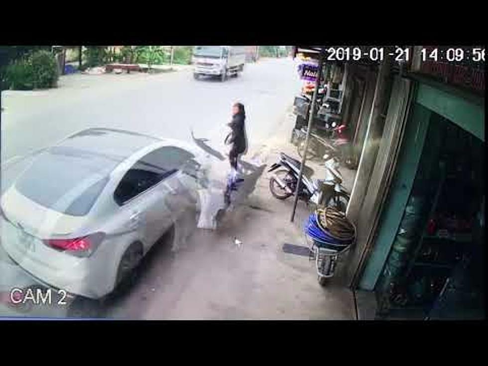 Speeding Car Comes Within Inches of Striking Woman [VIDEO]