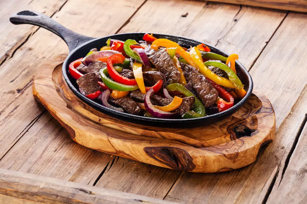 Beef Fajitas with colorful bell peppers in cast iron pan