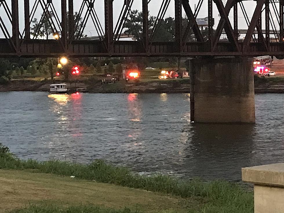 Woman Dies After Driving into Red River