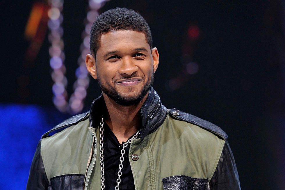 Usher Signing More Papers?