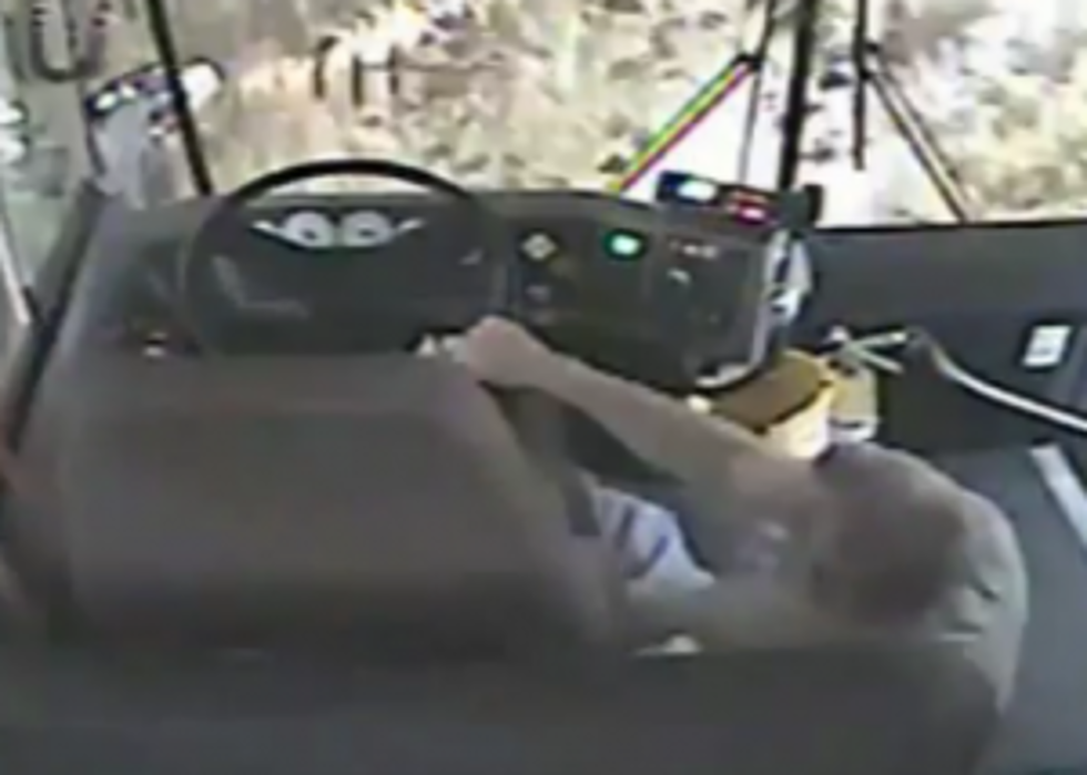 School Bus Driver Does Not Wear Seat Belt, Falls Out of His Seat and Crashes Into a House [VIDEO]