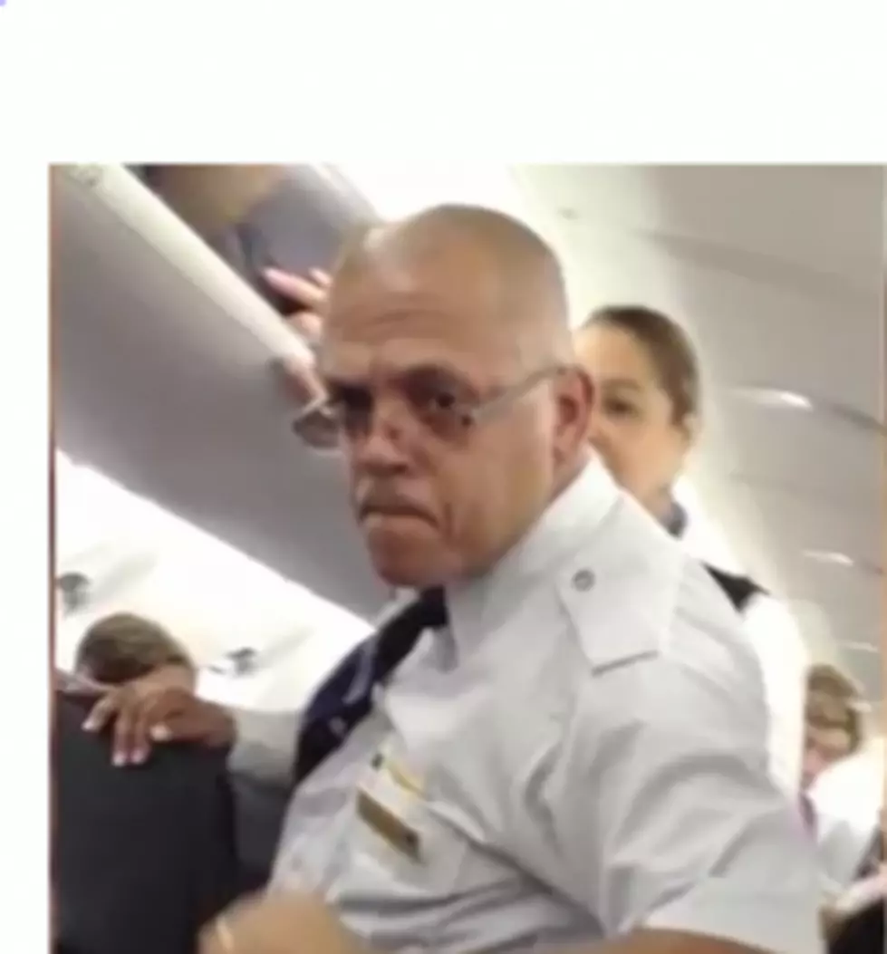 Flight Attendant Snaps and Dares Passengers to Leave Plane [VIDEO]