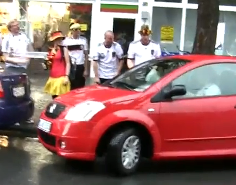 Soccer Hooligans Cheer For Woman as She Tries to Park Her Car [VIDEO]