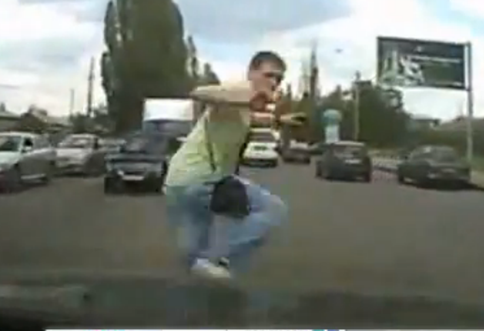 Don’t Try This at Home: Russian Superman Stops a Car Chase [VIDEO]