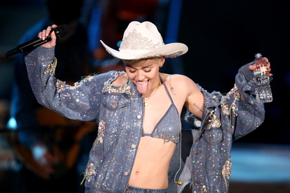 Miley Cyrus Asked to Prom by Naked Kid With Foam Finger (Video)
